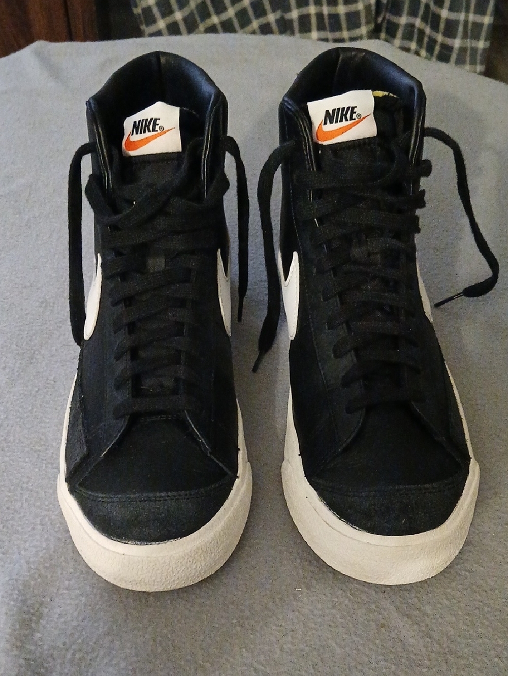 Nike Black and White High-Top Sneakers with Orange Swoosh